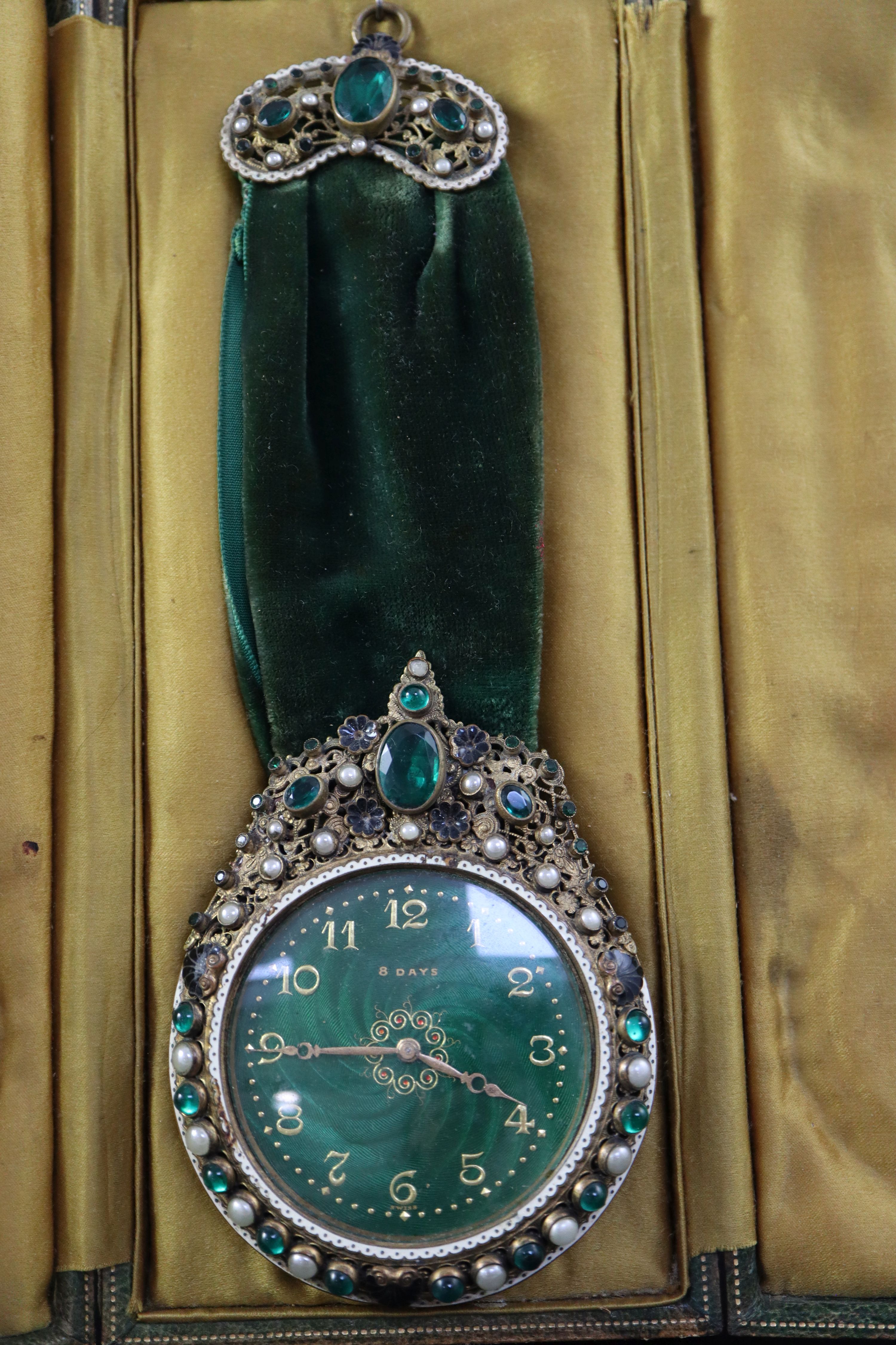 A 1930s Swiss be-jewelled brass eight day pendant timepiece, cased